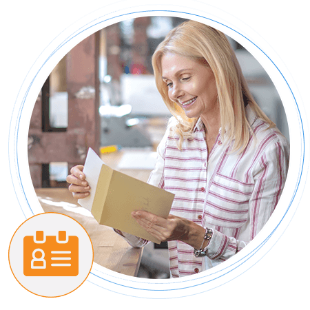 Woman reviewing physical mail – Targeted mailing lists for direct marketing campaigns and consumer data accuracy