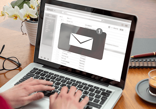 Laptop displaying email icon – Email Append service for enhancing contact lists and boosting campaign reach
