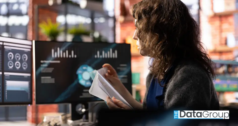 Remote worker at home watching business conference on pc monitor
