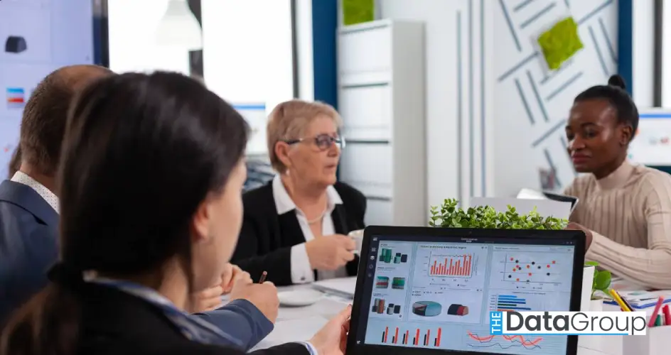 young woman analysing charts laptop start up business meeting room