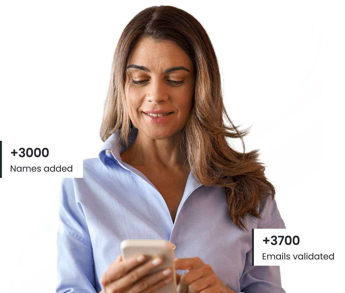 Smiling woman on mobile phone with shopping bags – Accurate phone append services for consumer outreach