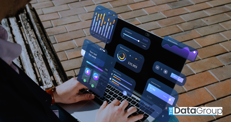 Person using a laptop outdoors with translucent dashboard panels floating above the screen showing charts, transaction totals, and task widgets. The scene represents digital analytics or financial data management on a mobile computer.